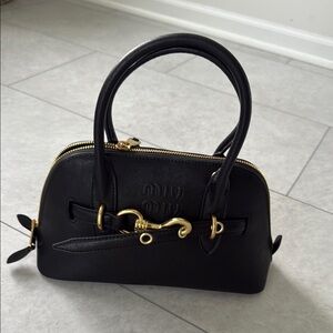Miu Miu Black Satchel with Gold Accents